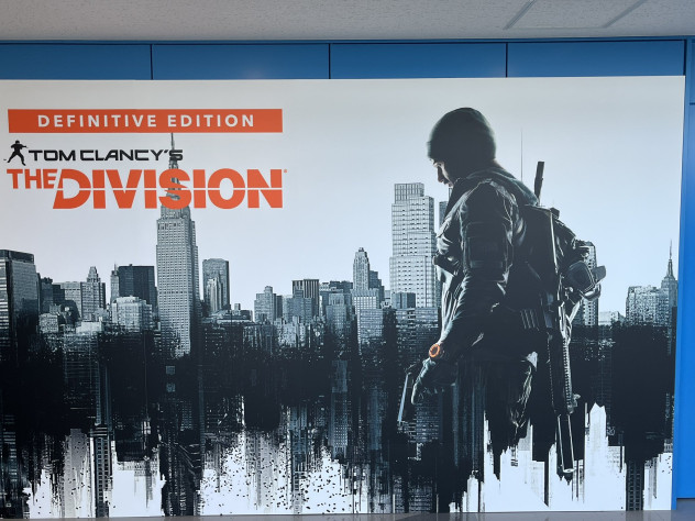 It looks like ubisoft is preparing a re release of the division a poster for the project was spotted at an event in japan